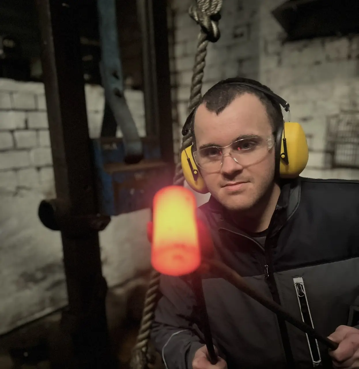 Engineer inspecting heated metal during a Sheffield forging operation